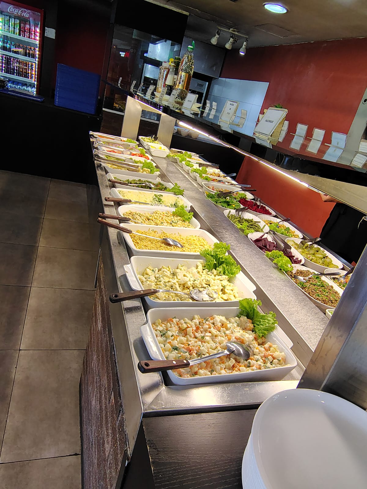 A fresh buffet lunch layout at a seafront restaurant next to Praia do Foguete in Cabo Frio, Brazil
